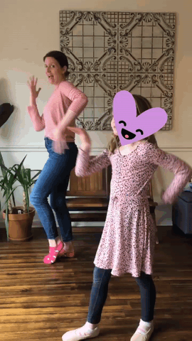 a mom and her daughter play freeze dance